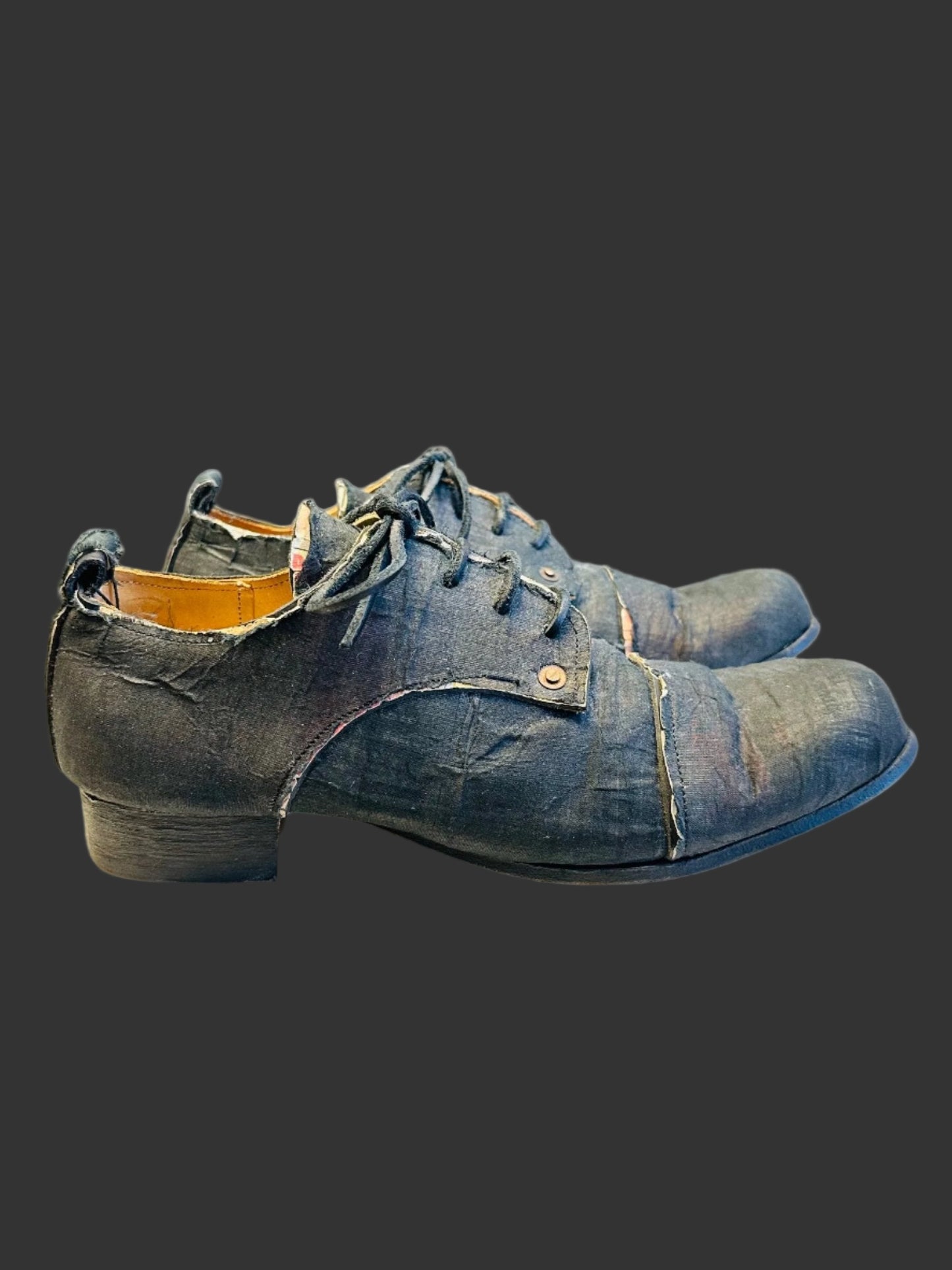 Black Voile over Newspaper Print Derbies by Paul Harnden