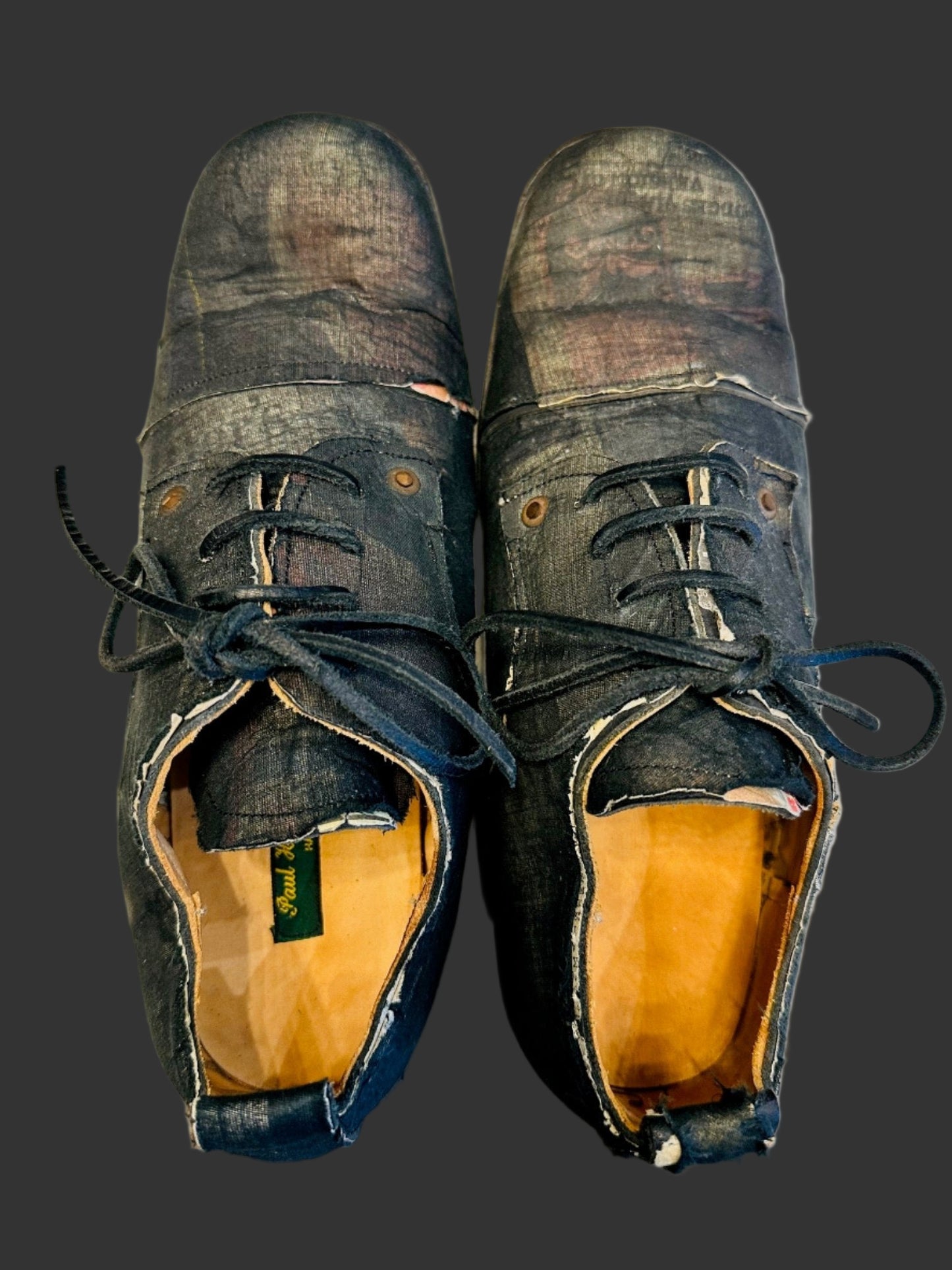 Black Voile over Newspaper Print Derbies by Paul Harnden