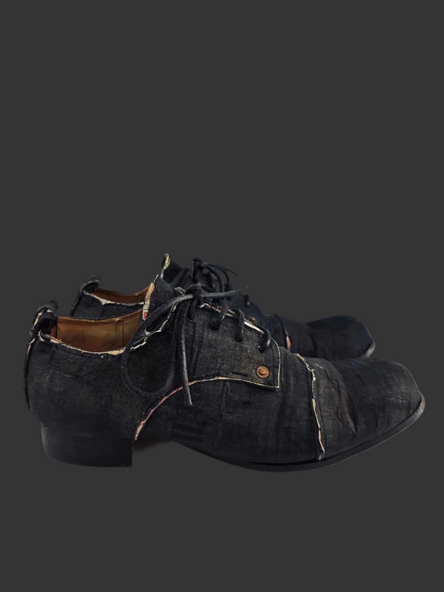 Black Voile over Newspaper Print Derbies by Paul Harnden
