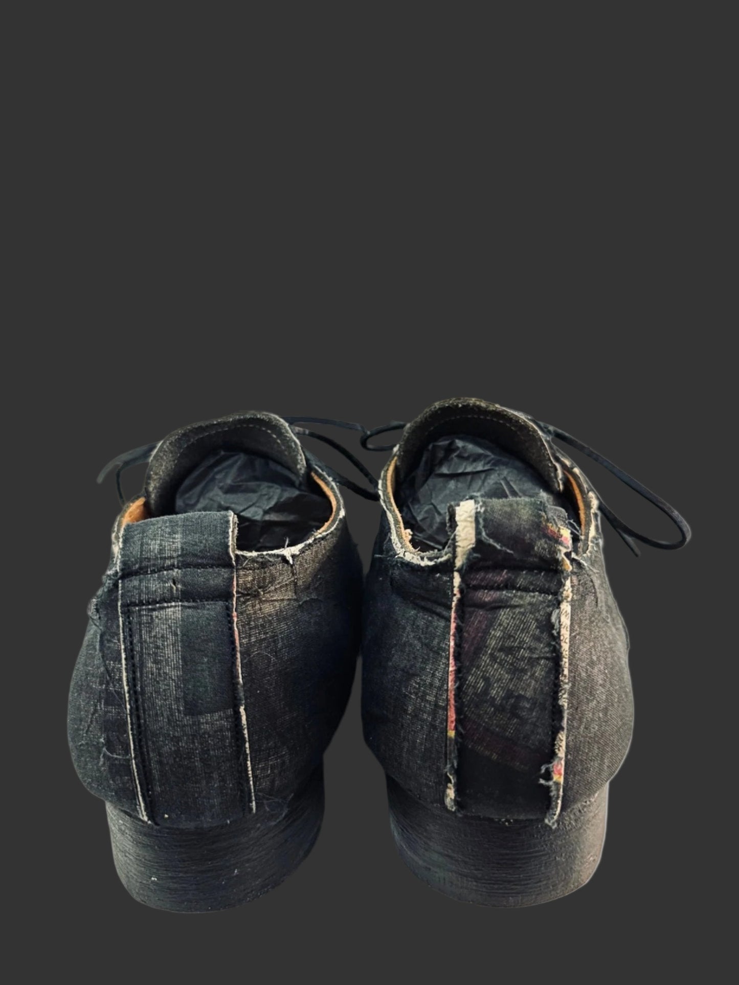 Black Voile over Newspaper Print Derbies by Paul Harnden