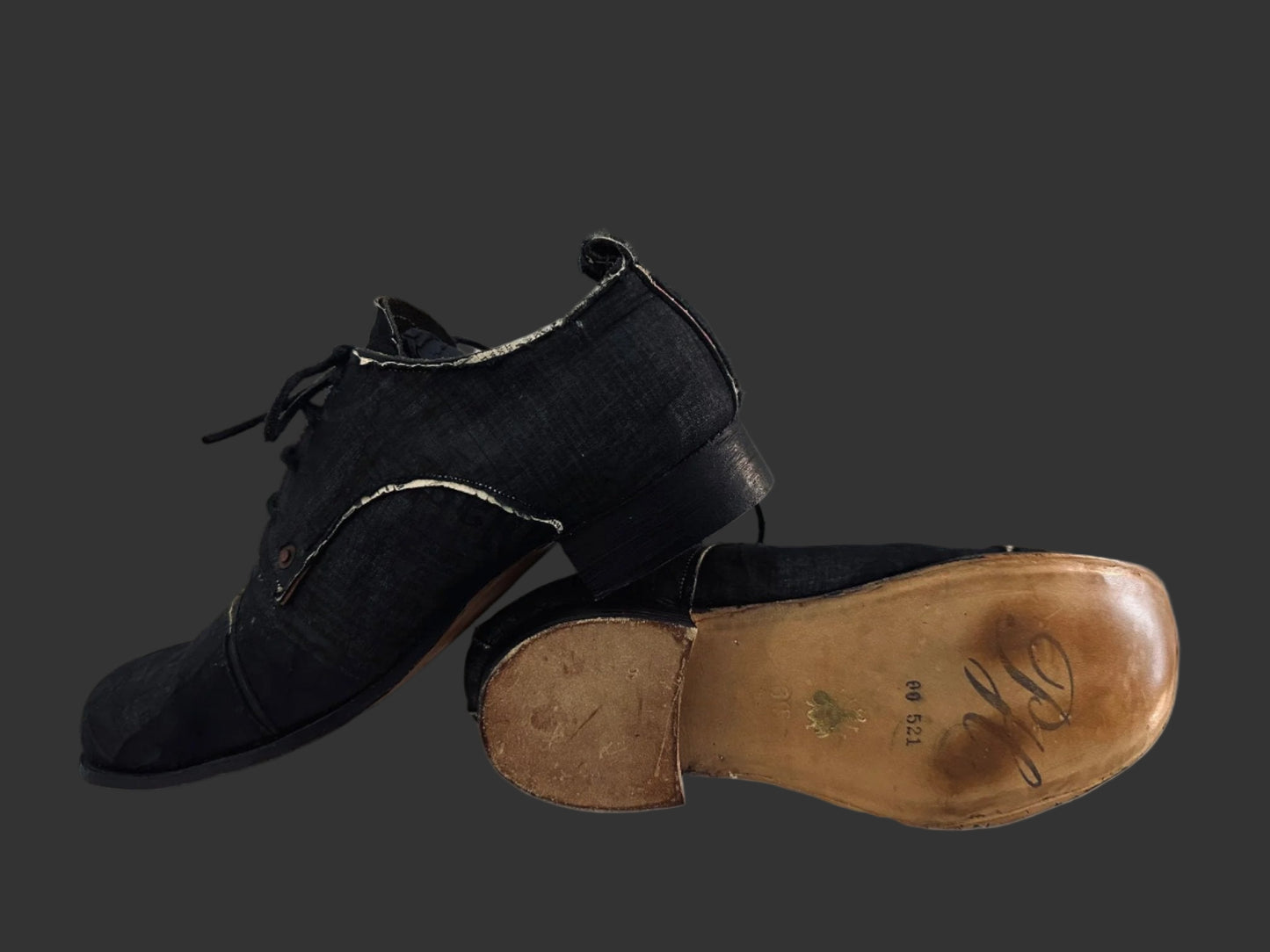 Black Voile over Newspaper Print Derbies by Paul Harnden